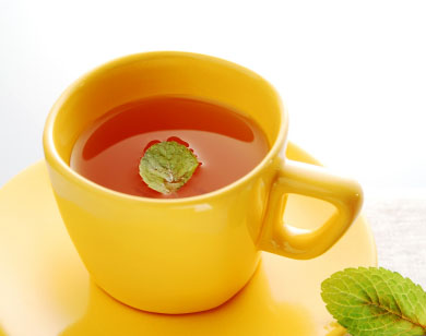 Cup of Velocitea with mint leaf